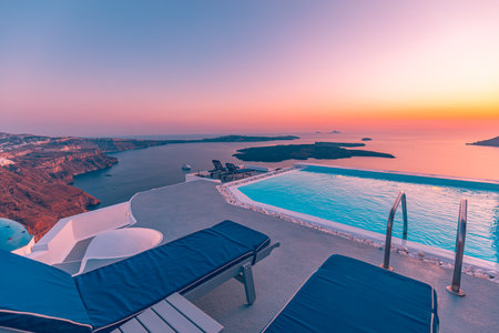 Amazing evening landscape, infinity pool caldera view Santorini, Greece chairs at sunset. Romantic couple destination with sunset sky wonderful summer scenery travel vacation 17.18のeditorial素材
