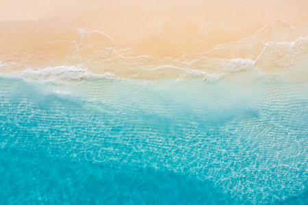 Summer Mediterranean seascape waves, blue sea water in sunshine. Top view from drone. Sea aerial...