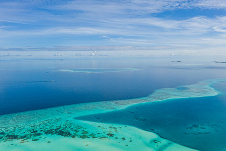 Great barrier reef blue sea view. Beautiful aqua and turquoise waters, with coral reef patterns in...