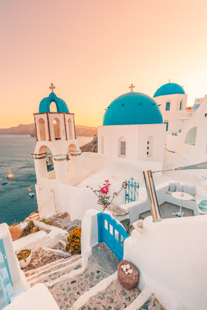 Europe summer destination. Traveling concept, sunset famous landscape of Santorini island, Oia, Greece. Caldera view, colorful clouds, dream cityscape. Vacation panorama, amazingの写真素材