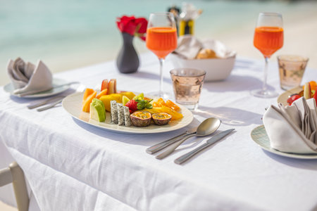 Luxury breakfast food on white table beautiful tropical sea view background, morning time summer holiday romantic vacation, luxury travel and lifestyle, resort hotel fruit saladの写真素材