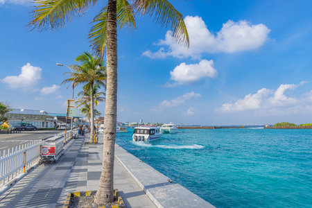 Boats at the harbor next to Ibrahim Nasir International Airport in Male, Maldives. Travelers arriving and departing from Male airport island. Hulhule island, Maldives - 01.19.22のeditorial素材