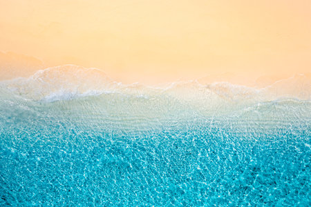 Relaxing aerial beach scene, summer vacation holiday. Waves surf with amazing blue ocean lagoon, sea shore, coastline. aerial drone top view. Peaceful bright beach, seasideの写真素材
