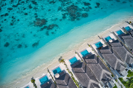 Maldives paradise island. Tropical aerial landscape, seascape water bungalows villas amazing sea lagoon beach. Exotic tourism destination, summer vacation background. Aerial travelの写真素材