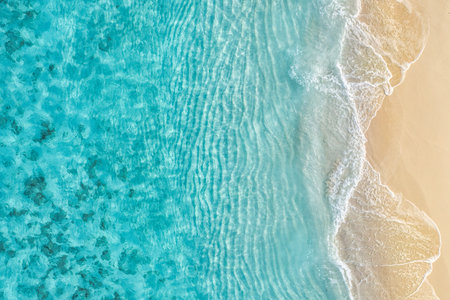 Summer seascape beautiful waves, blue sea water in sunny day. Top view from drone. Sea aerial, amazing tropical nature background. Beautiful bright sea waves splashing beach sandの写真素材