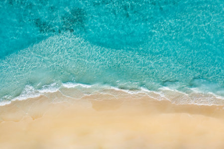 Relaxing aerial beach scene, summer vacation holiday template. Waves surf with amazing blue ocean lagoon, sea shore, coastline. Aerial drone top view. Bright beach panorama seasideの写真素材