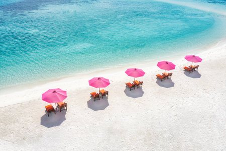 Amazing tranquil sea sand sky. Recreational summer travel tourism. Aerial landscape view chairs and umbrellas paradise island beach seaside. Resort vacation, exotic tropical natureの写真素材