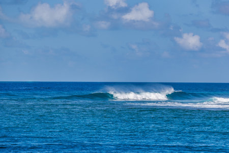 Beautiful panorama of splashing blue wave curl. Maldives island ocean lagoon with small waves splashing, idyllic nature scenic. Peaceful viewの写真素材