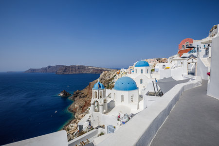 Europe summer destination. Traveling sunny famous landscape of Santorini island, Oia, Greece. Caldera sea view, blue sunny sky dream cityscape. Vacation panorama fantastic outdoorsの写真素材