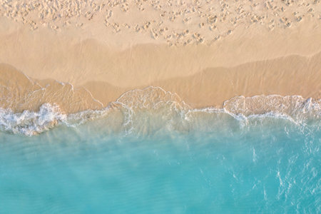 Summer seascape beautiful waves, blue sea water in sunny day. Top view from drone. Sea aerial...
