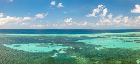 Amazing summer nature landscape. Stunning sunny beach shore relaxing peaceful inspirational beach vacation. Shallow ocean lagoon coral reef amazing blue tones. Abstract seaの写真素材
