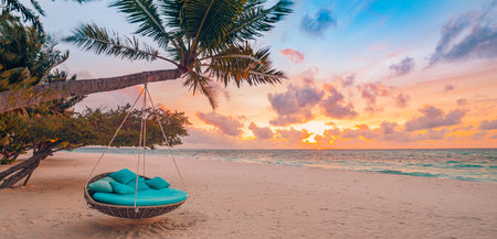 Tropical beach sunset as summer landscape with luxury resort beach swing or hammock and white sand calm sea for sunset beach landscape. Tranquil romantic vacation summer holidayの写真素材