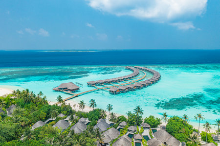 Maldives paradise scenery. Tropical aerial landscape seascape long jetty, water villas amazing sea and lagoon beach, tropical nature. Exotic tourism destination summer vacationの写真素材
