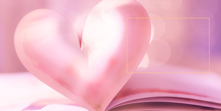 Closeup love Valenstines day design. Perfect heart shape book pages romantic. Vintage style text lights reflections. Beautiful February Valentine day art. Couples anniversaryの写真素材