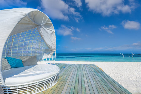 Relax luxury VIP beach deck white pavilion in sunshine blue sky day. Luxury vacation and beach holiday tropical resort, hotel. Leisure lifestyle seaside, paradise island vacationの写真素材
