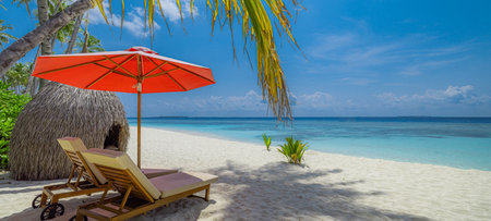 Fantastic summer vibes with sunny leisure chairs and umbrella on tropical beach landscape featuring golden sand palm trees perfect vacation travel relaxation seaside escapeの写真素材