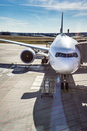 Airplane boarding passengers preparing for takeoff travel transport at airport terminal modern aircraft aviation journey business and leisure travel flight departureの写真素材