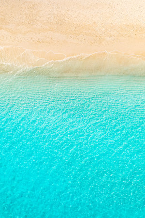 Aerial top view waves sand sea bay exotic sun shore tropical island coast turquoise water summer vacation travel background wallpaper peaceful nature scenic calm ocean landscapeの写真素材