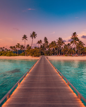 Romantic sunset Maldives pier stretching calm turquoise sea, dreamy sky warm color idyllic tropical island scene perfect summer vacation honeymoon travel relaxation paradise escapeの写真素材