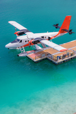 Amazing Maldives seaplanes dock aerial view, tropical travel tourism transportation background,...