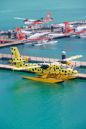 Exclusive aerial view of Maldives seaplanes dock tropical island travel tourism transportation hub, luxury vacation destination editorial background ocean sky scenicの写真素材