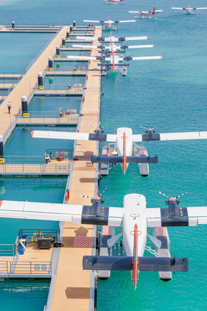 Seaplane jetty docked at floating platform in Male Maldives aerial view over turquoise water perfect summer travel transportation tropical island vacation scenic marine escapeの写真素材