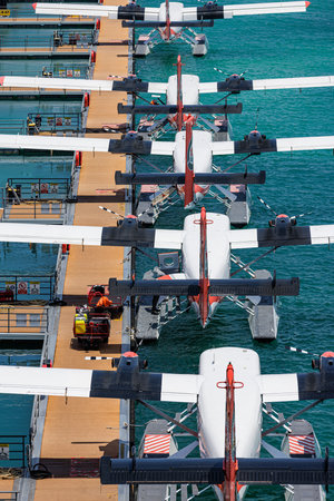 Seaplane jetty docked at floating platform in Male Maldives aerial view over turquoise water perfect...