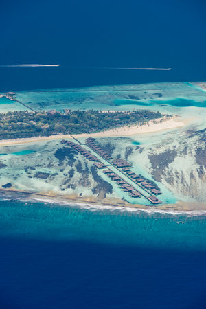 Stunning Maldives water villas and bungalows luxury travel vacation aerial view of atoll reef lagoon ocean turquoise tropical paradise perfect island getaway escapeの写真素材