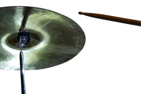 Low profile shot of a crash cymbal with drumstick about to hit it. White background.の写真素材