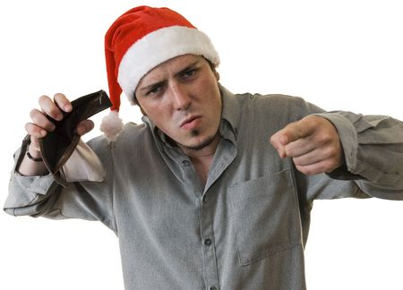 Angry young man with Santa hat holding an empty wallet and making barking mad face. White...