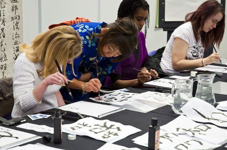 LONDON - JANUARY 30: Visitors in Shodo workshop during the Tokyo Day.  January 30, 2010 in London, England.のeditorial素材