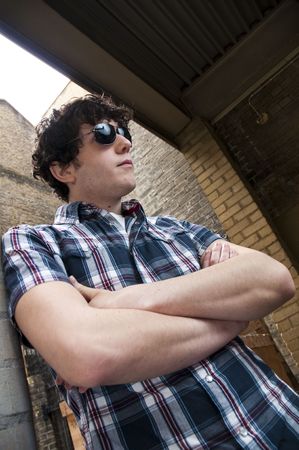 Street portrait of young man wearing sun glassesの写真素材