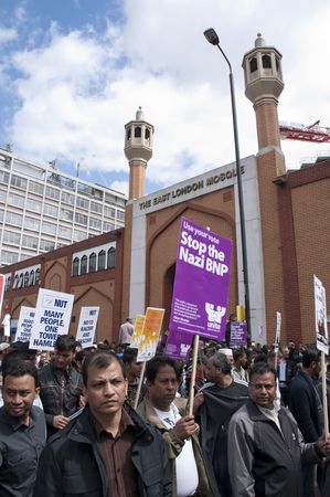 LONDON - JUNE 20: Thousands march in rally against the British National Party and the English Defence League in East London. June 20, 2010 in London, England.のeditorial素材