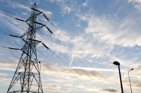 Low angle perspective shot of electric tower with at dusk.の写真素材