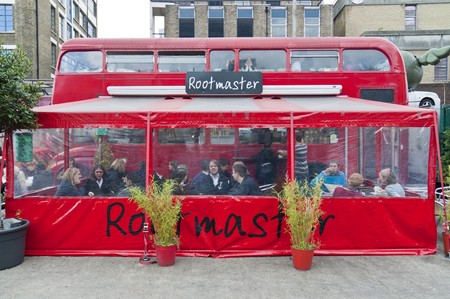 LONDON - OCTOBER 17: Restaurant built inside old double decker routemaster busin Bricklane market, which takes place every Sunday. October 17, 2010 in London, England.のeditorial素材