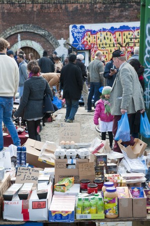 LONDON - OCTOBER 17: Customers and tourists in Bricklane market, which takes place every Sunday....