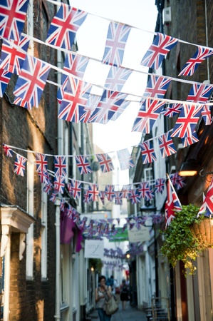 LONDON - APRIL 24: Central London hangs up buntings for Prince William and Catherine Middleton's royal wedding celebration to take place April 29 at Westminster Abbey. April 24, 2011 in London, England.のeditorial素材