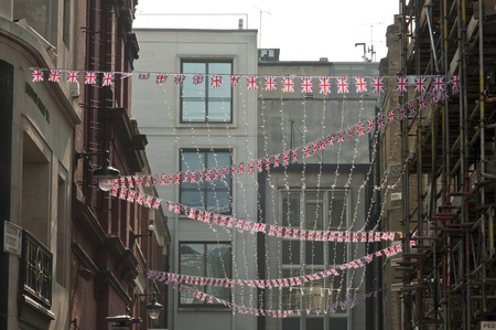 LONDON - APRIL 24: Central London hangs up buntings for Prince William and Catherine Middleton's royal wedding celebration to take place April 29 at Westminster Abbey. April 24, 2011 in London, England.のeditorial素材