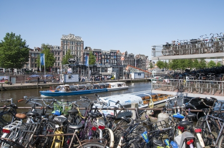 AMSTERDAM, HOLLAND - MAY 28: busy bicycle parking lot close to the central station. May 28, 2012 in Amsterdam. It is estimated that there are about 550 thousand bikes in Amsterdam.のeditorial素材