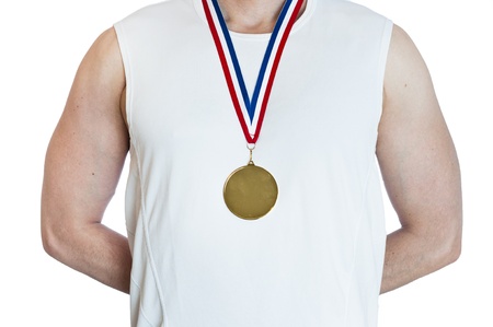 Cropped torso of man standing in attention wearing blank sports gold medal.の写真素材