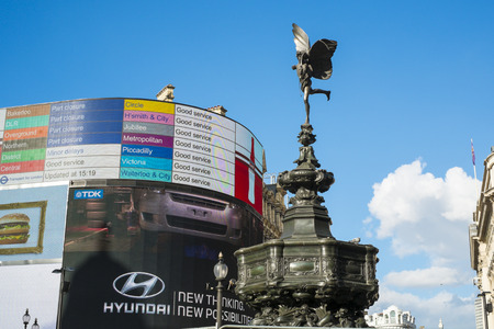 LONDON, UK - MARCH 14: Alfred Gilbert's statue of Eros with light of famous Piccadilly Circus corner showing underground lines service status. March 01, 2014 in London.のeditorial素材