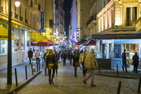Paris, FRANCE - OCTOBER 19: Night shot of busy Rue de la Huchette with lots of pedestrians. October 19, 2013 in Paris.のeditorial素材