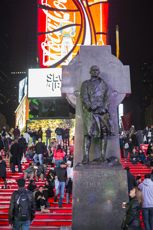 NEW YORK, US - NOVEMBER 22: Statue of Father Duffy in Times Square at night. November 22, 2013 in New York.のeditorial素材