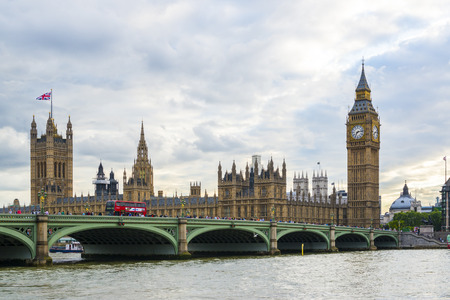 LONDON, UK - AUGUST 12: Side view of busy Westminster Bridge over the Thames with Houses of...