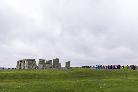 STONEHENGE, WILTSHIRE, UK - AUGUST 17: Tourists queueing for the ancient archeological site of Stonehenge, which was added to the UNESCO World Heritage Sites in 1986 and dates back from 3100BC. August 17, 2013 in Wiltshire, UK.のeditorial素材