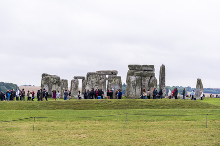 STONEHENGE, WILTSHIRE, UK - AUGUST 17: Tourists queueing for the ancient archeological site of Stonehenge, which was added to the UNESCO World Heritage Sites in 1986 and dates back from 3100BC. August 17, 2013 in Wiltshire, UK.のeditorial素材