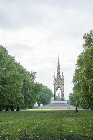 LONDON, UK - SEPTEMBER 15: Tree lined field in Kensington Gardens, with the Albert Memorial in the background. September 15, 2013 in London.のeditorial素材