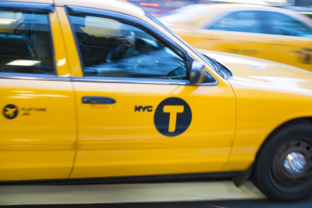NEW YORK, US - NOVEMBER 21: Motion blurred shot of famous New York yellow taxi. November 21, 2013 in...