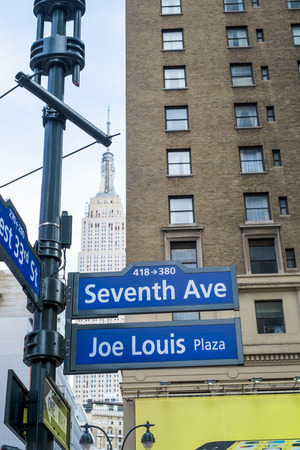 NEW YORK, US - NOVEMBER 23: Seventh Avenue and Joe Louis Plaza street signs. November 23, 2013 in New York.のeditorial素材