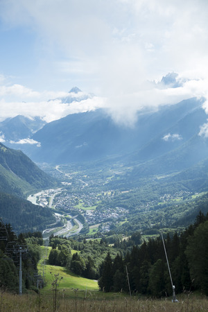 COL DE VOZA, FRANCE - AUGUST 24: Chalets with Les Houches village in the background. Les Houches is one of the Tour du Mont Blanc villages. August 24, 2014 in Col de Voza.のeditorial素材